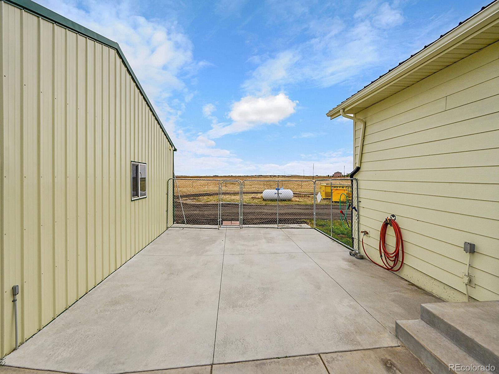 10660 Schumaker Road Bennett, CO 80102 - Photo 36 of 50 a view of an entryway with wooden floor