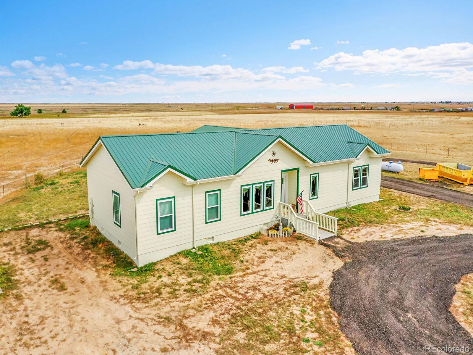 10660 Schumaker Road Bennett, CO 80102 - Photo 43 of 50 a view of a house with a ocean view