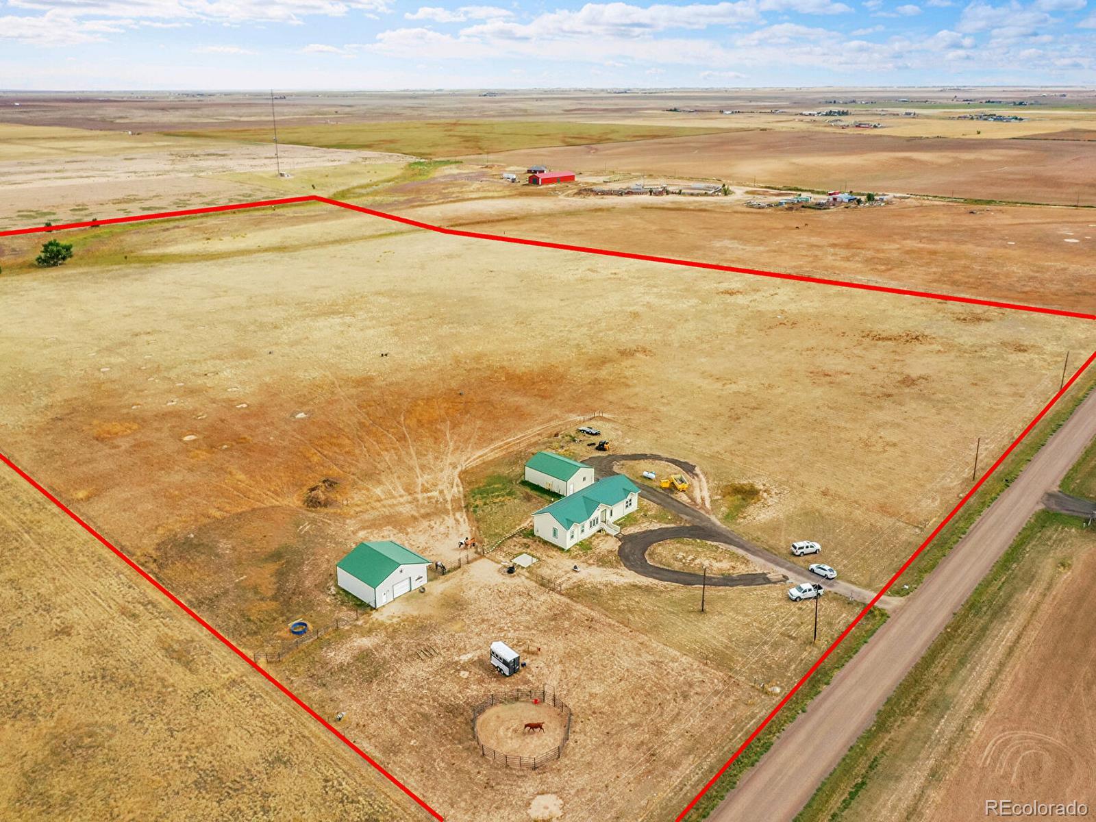 10660 Schumaker Road Bennett, CO 80102 - Photo 49 of 50 a view of a swimming pool and an ocean view