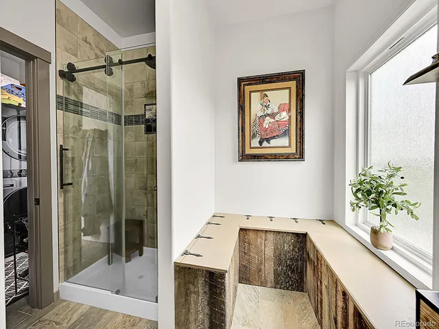 a bathroom with a bathtub and shower