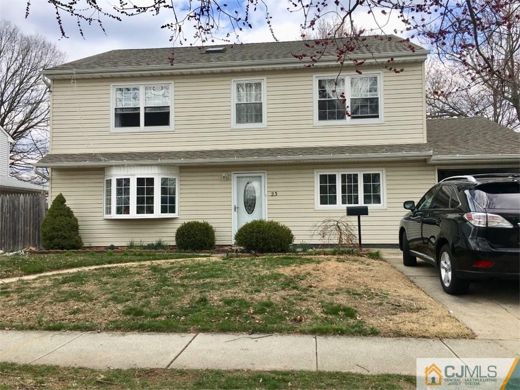 23 Raleigh Road Edison, NJ 08817 - Photo 1 of 19 a view of a car park in front of a house