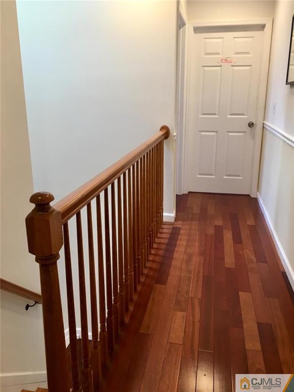 23 Raleigh Road Edison, NJ 08817 - Photo 14 of 19 a view of a room with wooden floor and staircase