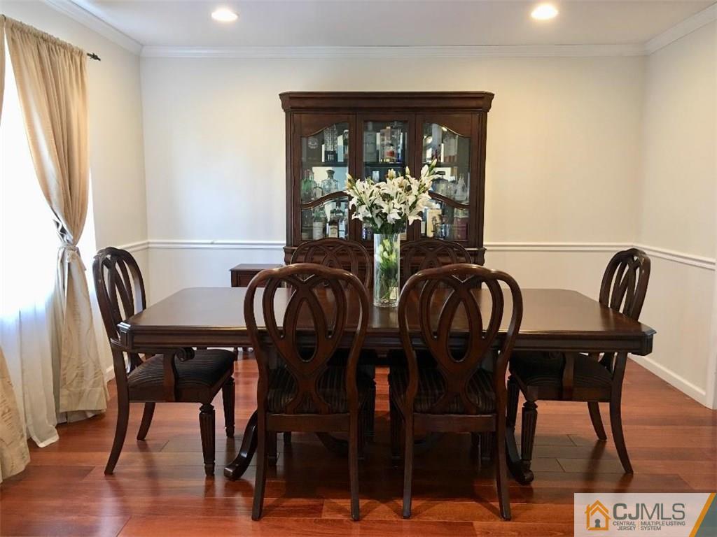 23 Raleigh Road Edison, NJ 08817 - Photo 4 of 19 a view of a dining room with furniture and wooden floor