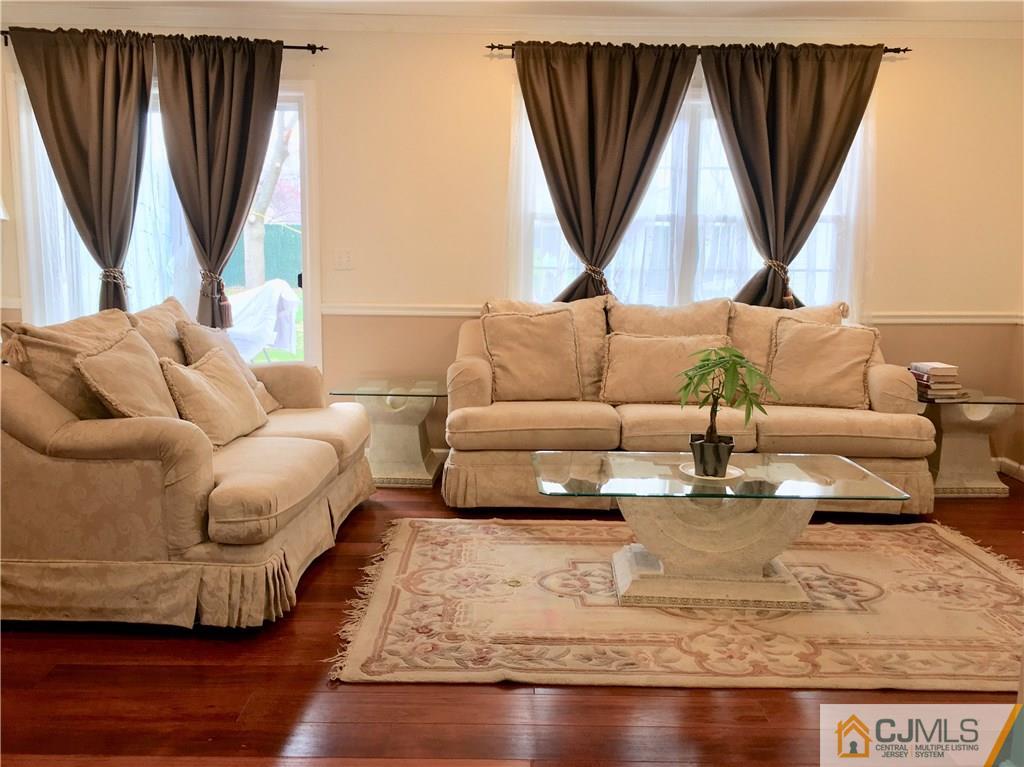 23 Raleigh Road Edison, NJ 08817 - Photo 5 of 19 a living room with furniture and a large window