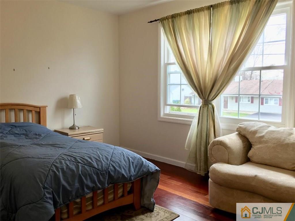 23 Raleigh Road Edison, NJ 08817 - Photo 10 of 19 a bed sitting in a bedroom next to a window