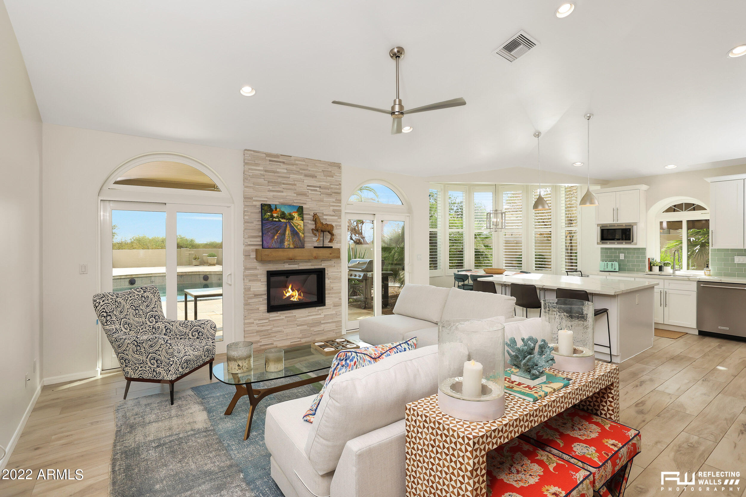 10085 East Doubletree Ranch Road Scottsdale, AZ 85258 - Photo 5 of 62 a living room with furniture a fireplace and a table