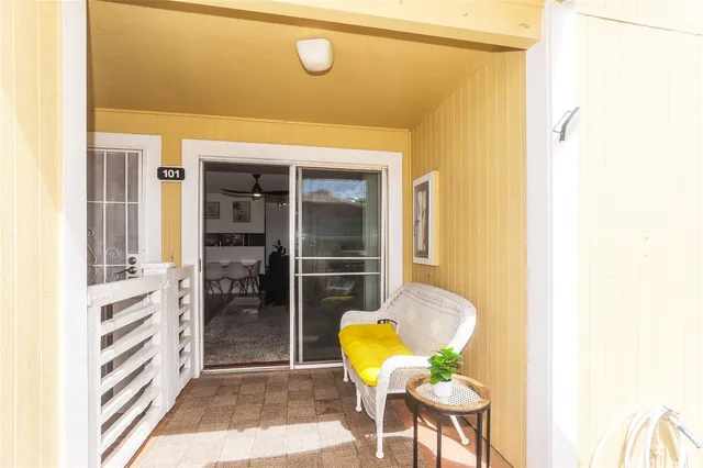 a view of living room with furniture and a rug