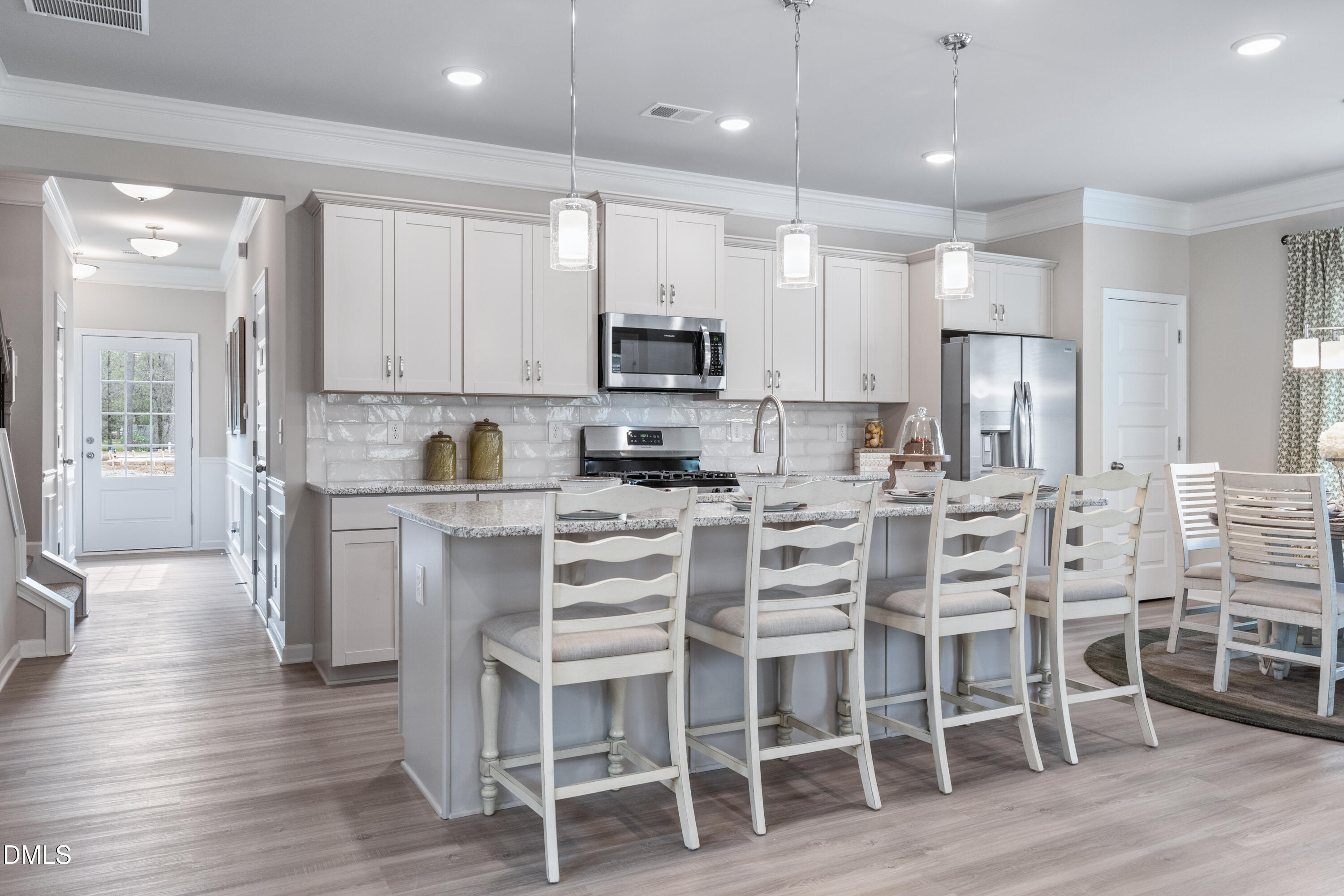 203 Courtside Drive Dunn, NC 28334 - Photo 12 of 38 a kitchen with cabinets and chairs