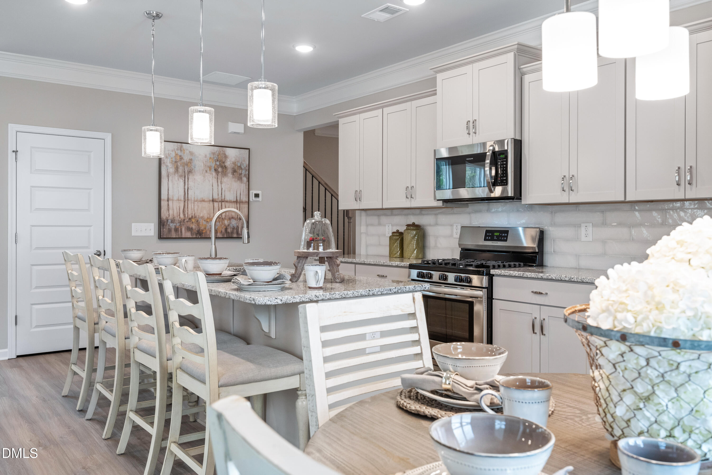 203 Courtside Drive Dunn, NC 28334 - Photo 14 of 38 a kitchen with stainless steel appliances kitchen island granite countertop a sink and cabinets