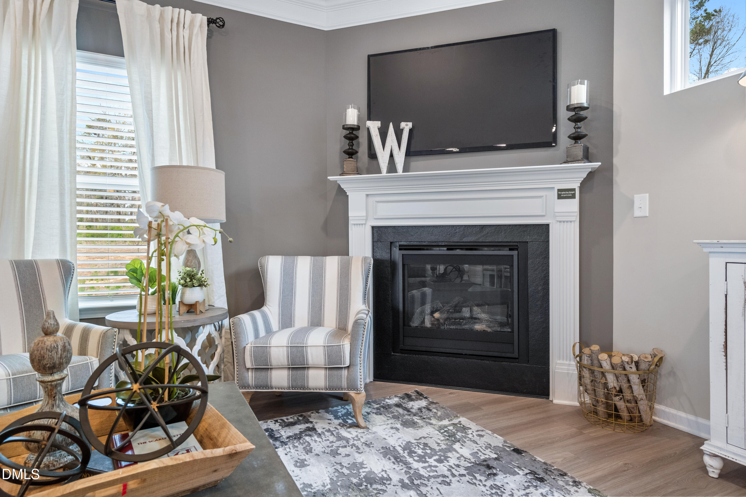 203 Courtside Drive Dunn, NC 28334 - Photo 16 of 38 a living room with furniture a flat screen tv and a fireplace