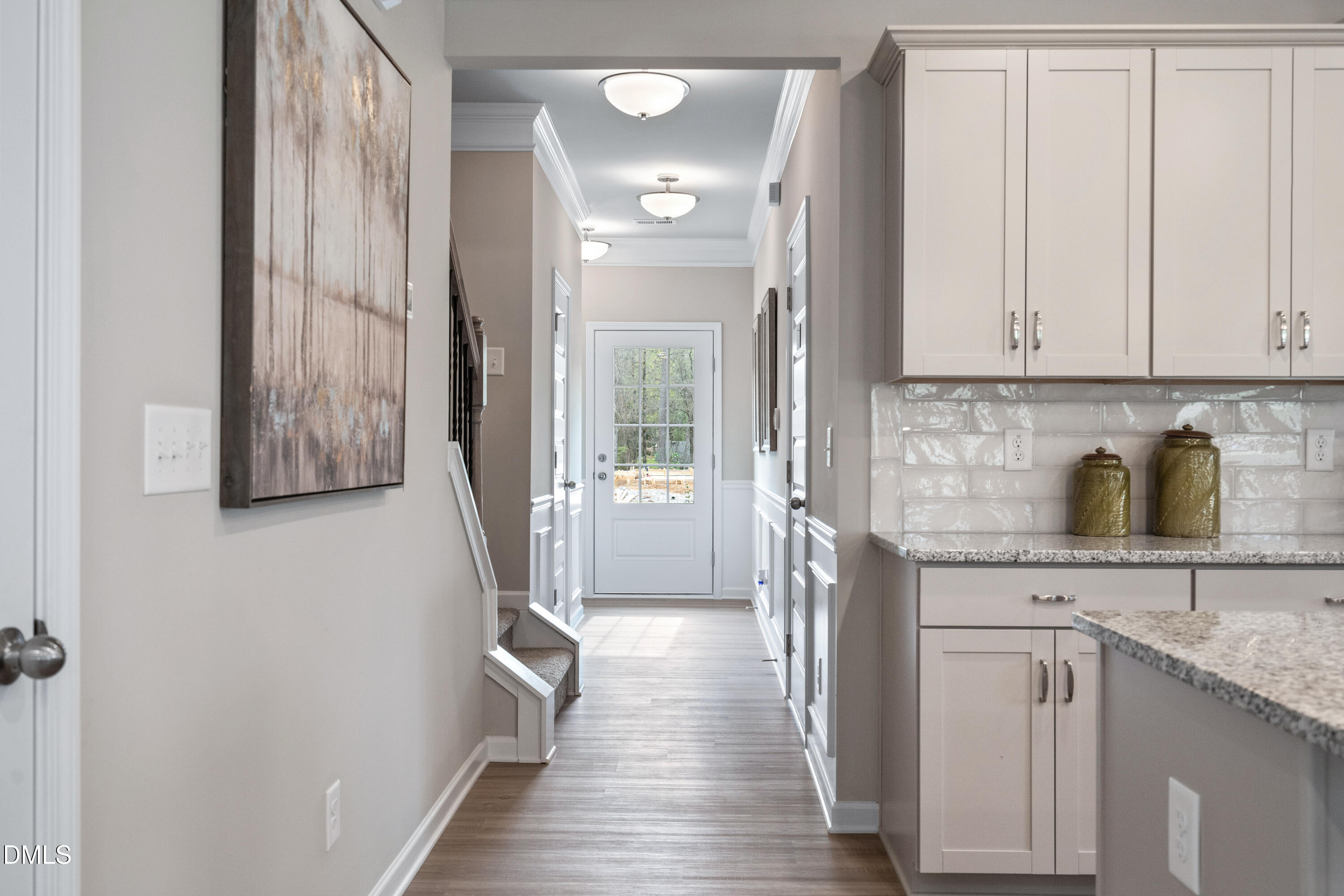 203 Courtside Drive Dunn, NC 28334 - Photo 18 of 38 a kitchen with granite countertop a sink and a refrigerator