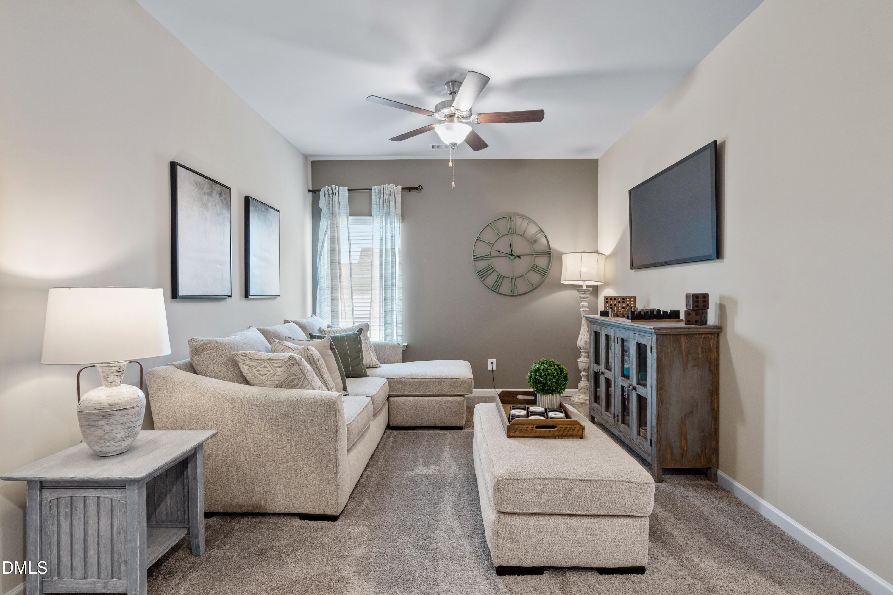 203 Courtside Drive Dunn, NC 28334 - Photo 20 of 38 a living room with furniture and a flat screen tv