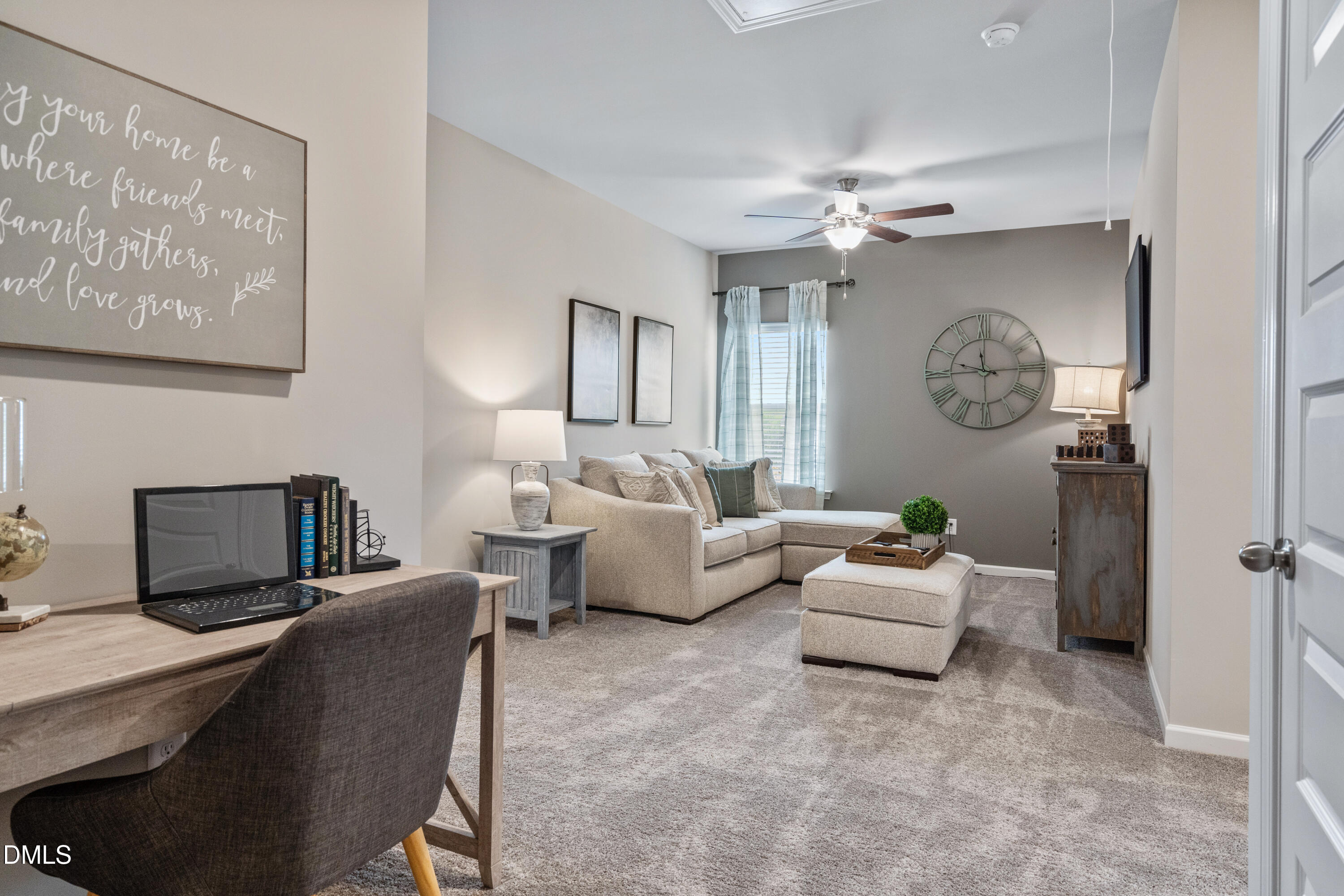 203 Courtside Drive Dunn, NC 28334 - Photo 21 of 38 a living room with furniture a chandelier and a window