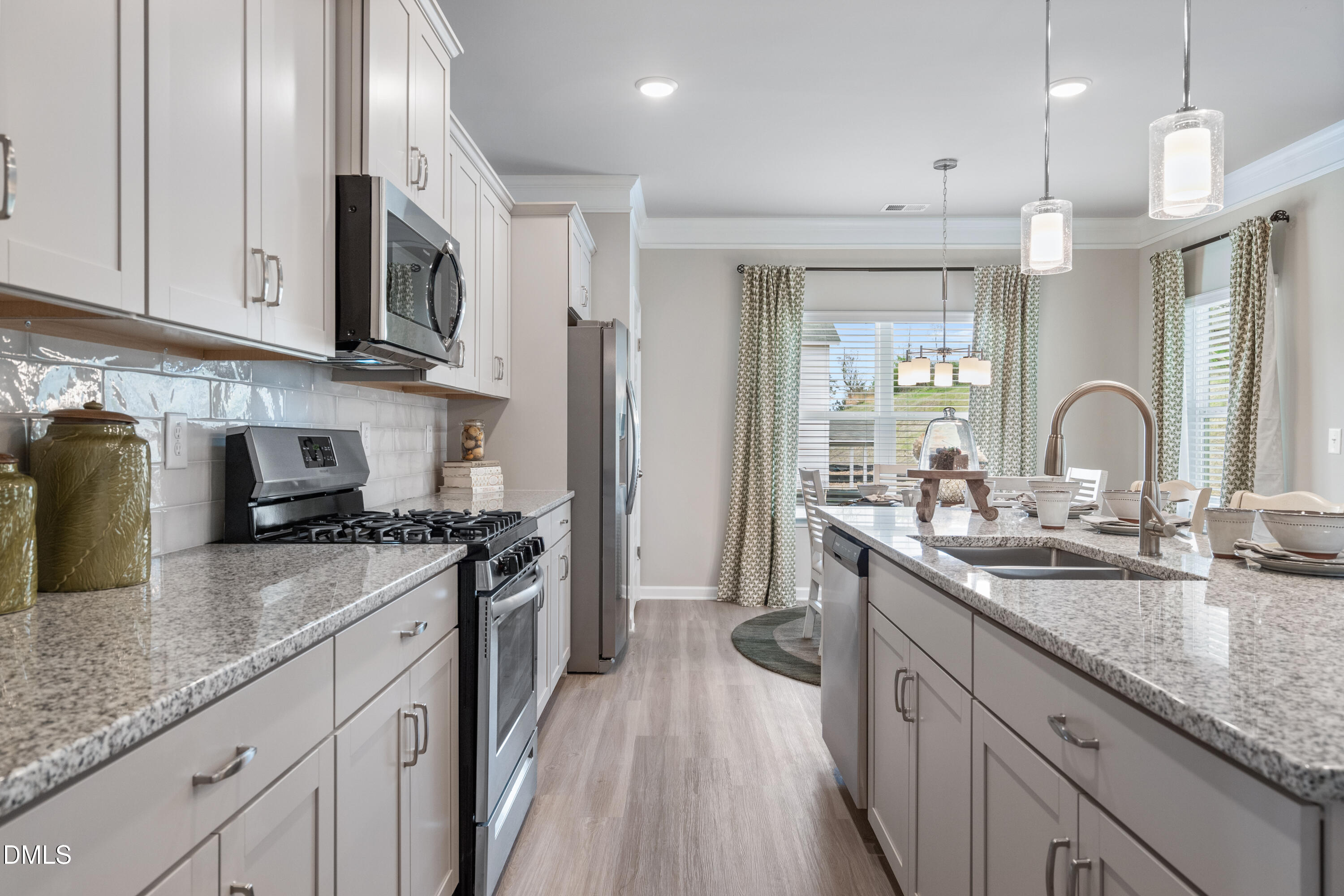 203 Courtside Drive Dunn, NC 28334 - Photo 6 of 38 a kitchen with stainless steel appliances granite countertop a sink stove and refrigerator