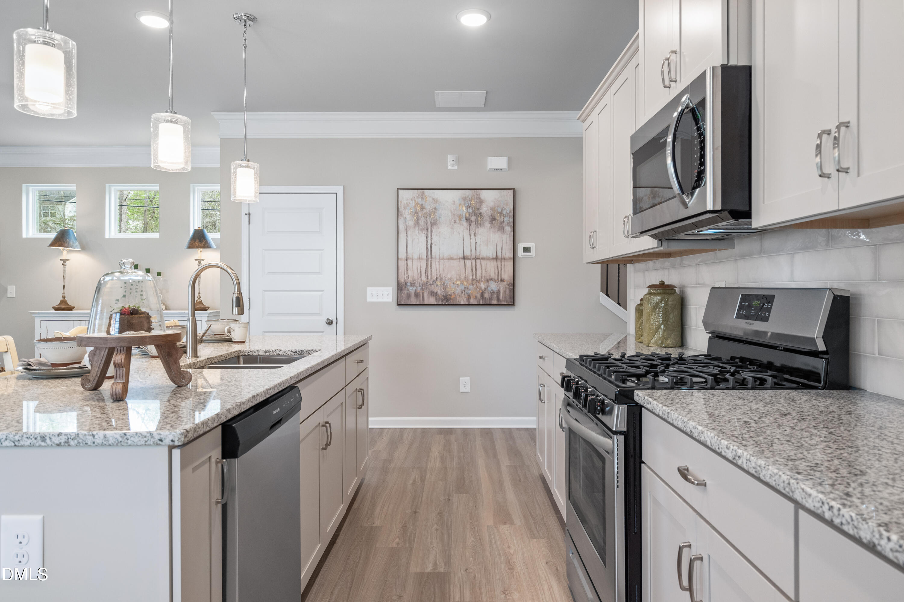 203 Courtside Drive Dunn, NC 28334 - Photo 7 of 38 a kitchen with stainless steel appliances granite countertop a stove a sink and a microwave
