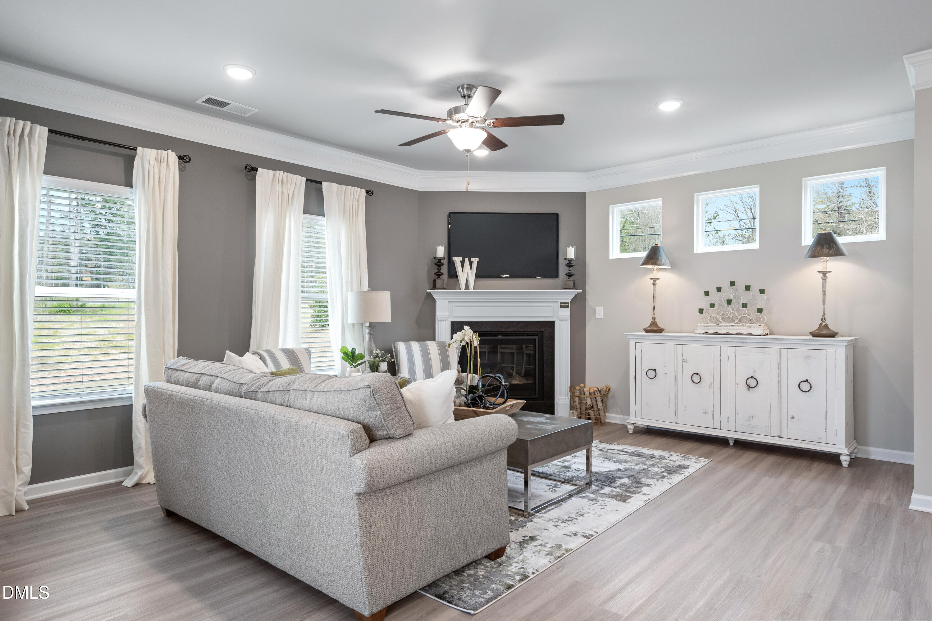 203 Courtside Drive Dunn, NC 28334 - Photo 9 of 38 a living room with furniture fireplace and window