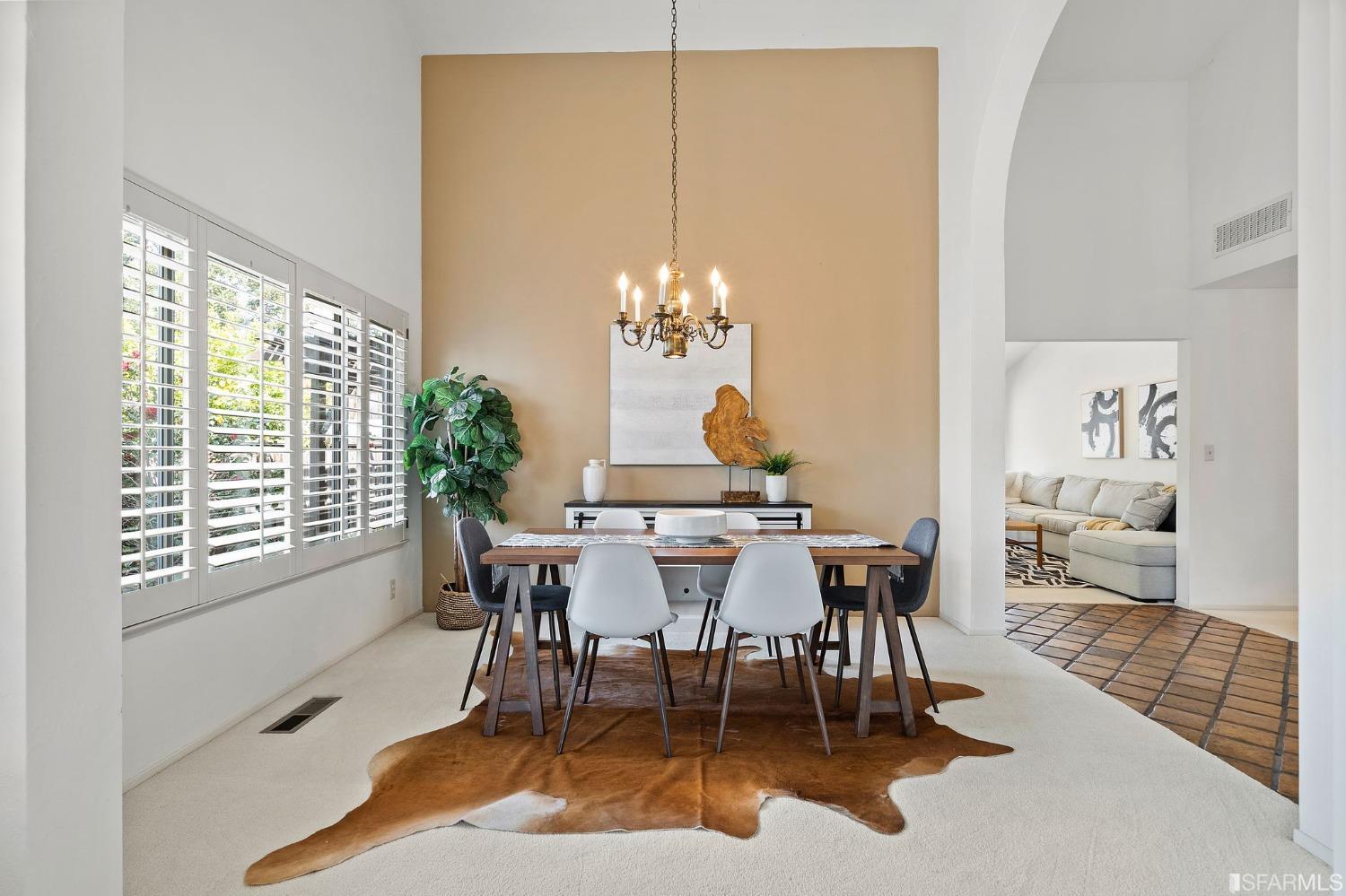 2590 Fox Circle Walnut Creek, CA 94596 - Photo 11 of 68 a dining room with furniture a rug and a chandelier