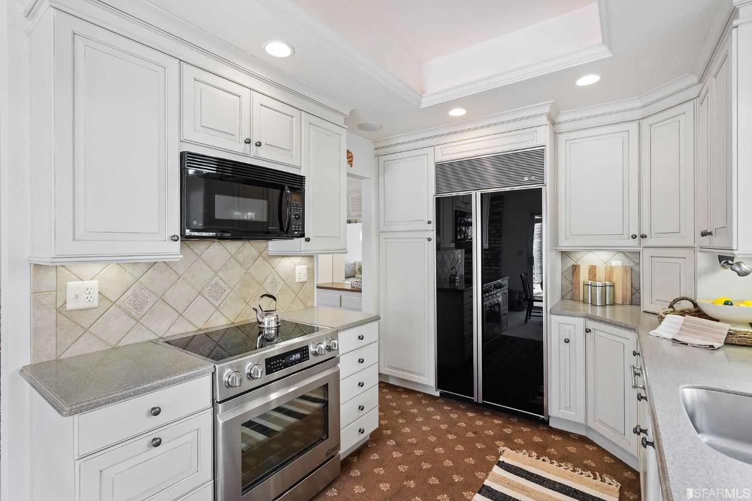 2590 Fox Circle Walnut Creek, CA 94596 - Photo 14 of 68 a kitchen with stainless steel appliances a stove microwave and a sink