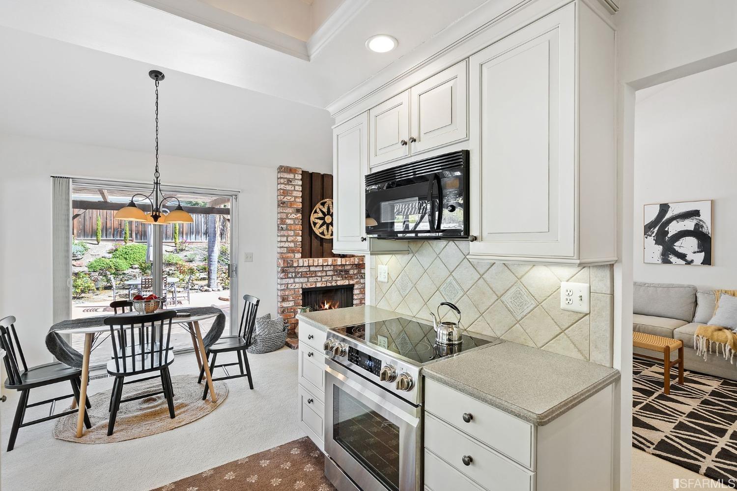 2590 Fox Circle Walnut Creek, CA 94596 - Photo 17 of 68 a kitchen with granite countertop a sink stove and cabinets