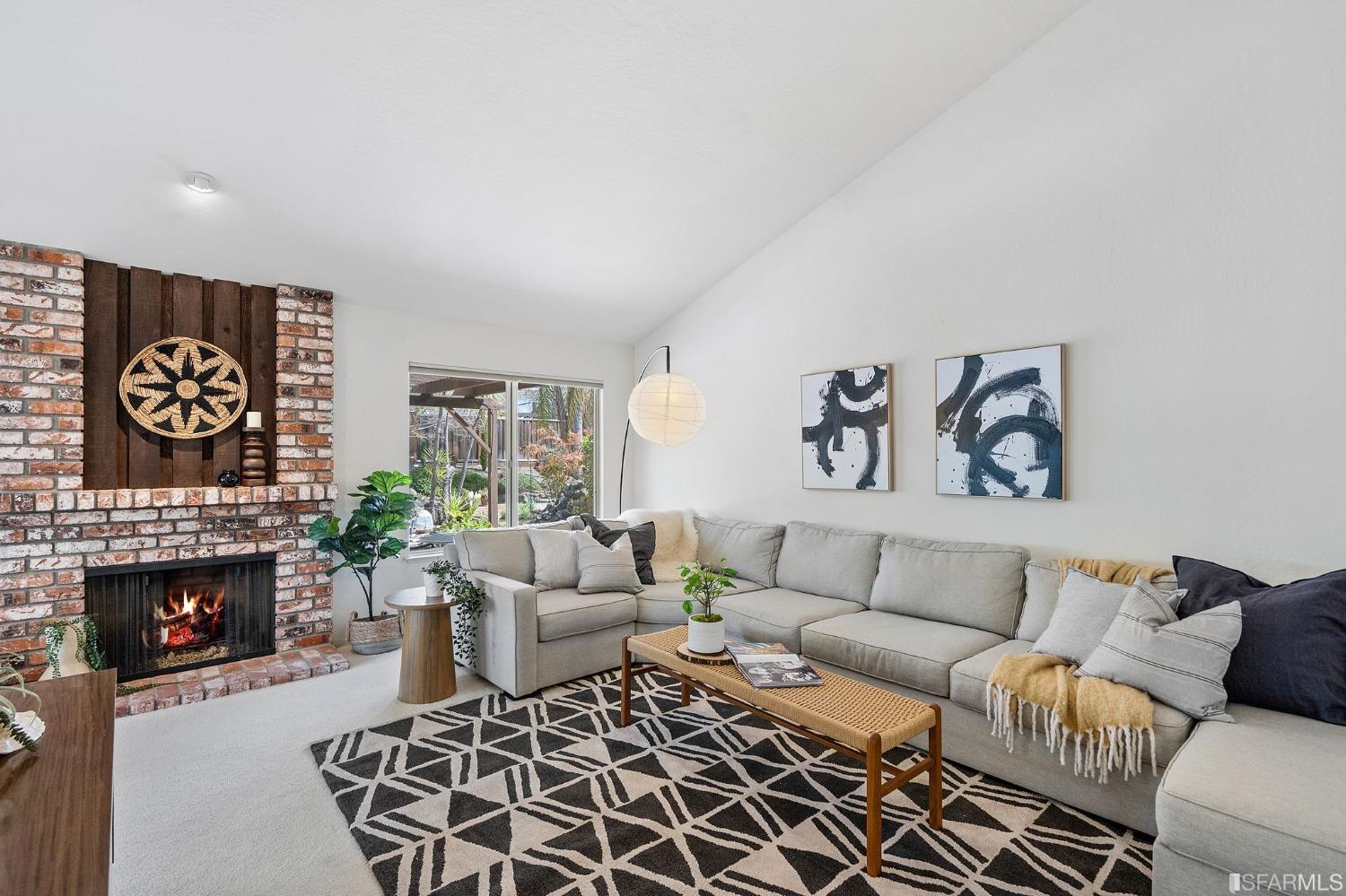 2590 Fox Circle Walnut Creek, CA 94596 - Photo 2 of 68 a living room with furniture a rug and a fireplace