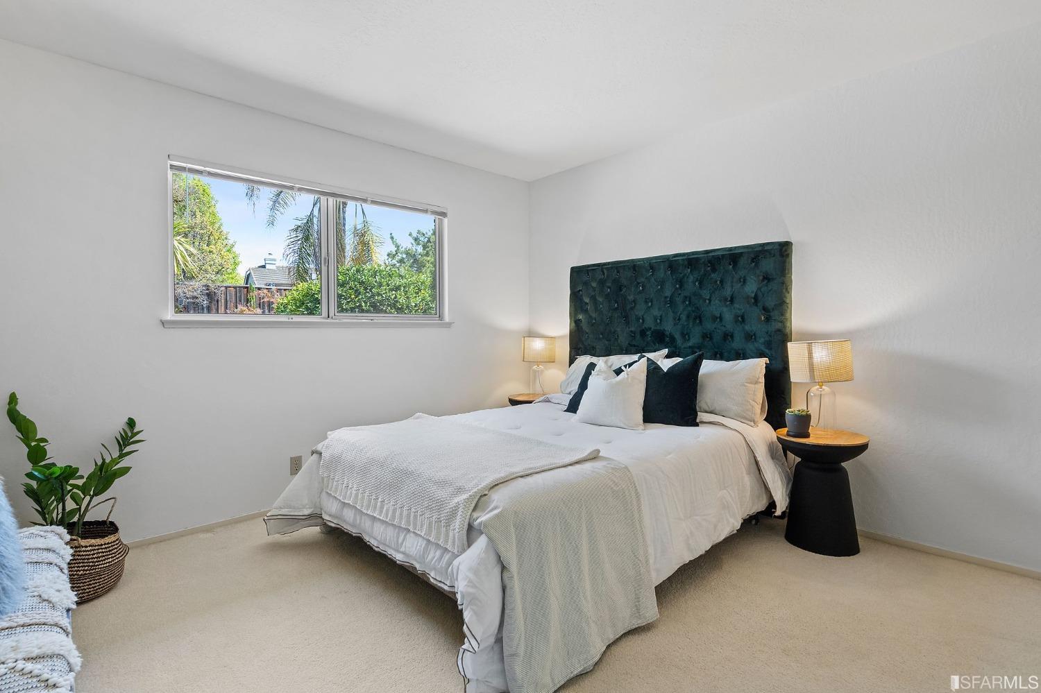 2590 Fox Circle Walnut Creek, CA 94596 - Photo 24 of 68 a bedroom with a bed and a potted plant