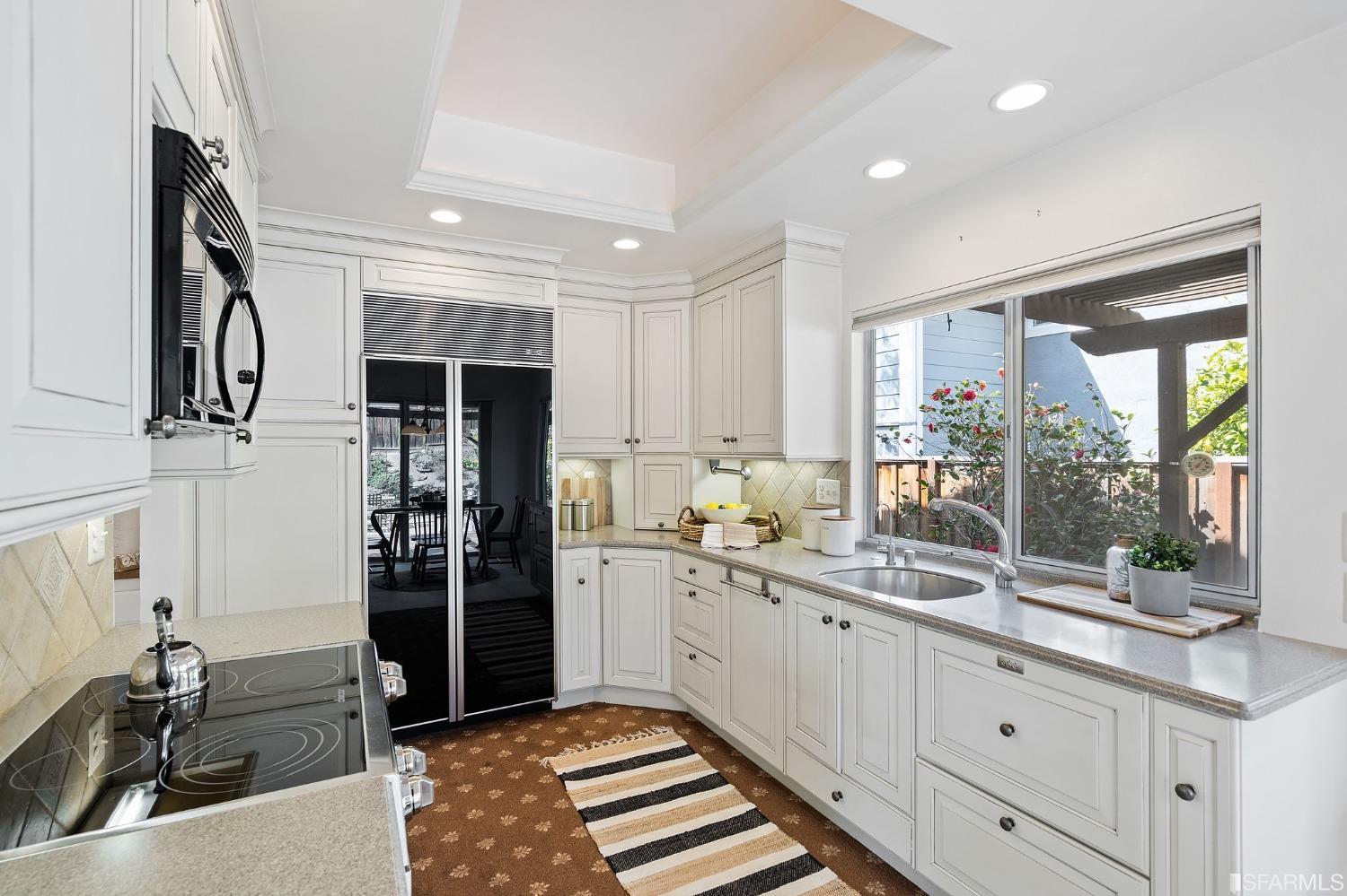 2590 Fox Circle Walnut Creek, CA 94596 - Photo 58 of 68 a kitchen with stainless steel appliances sink refrigerator and window