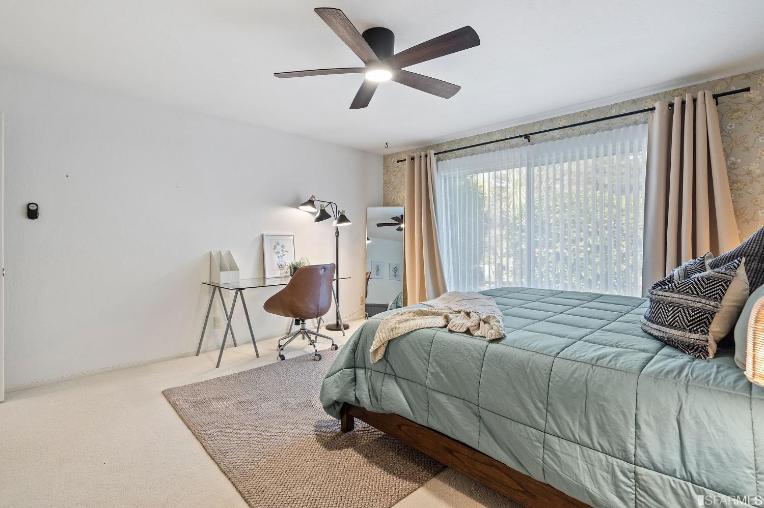 2590 Fox Circle Walnut Creek, CA 94596 - Photo 61 of 68 a bedroom with a bed and a chandelier