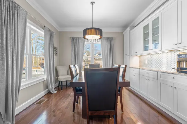 a dining room with furniture window wooden floor