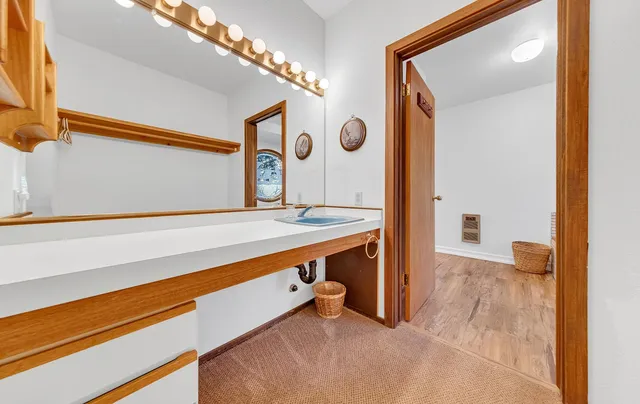 a bathroom with a sink and a mirror