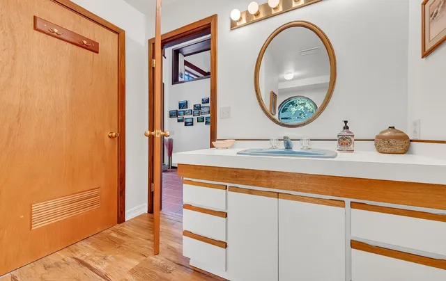 a bathroom with a sink and a mirror