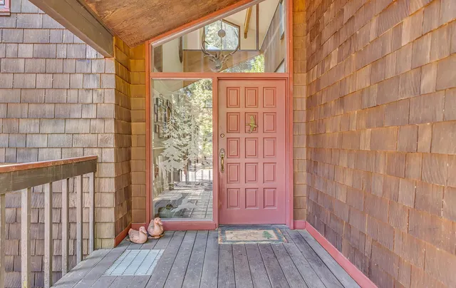 a view of balcony with wooden floor