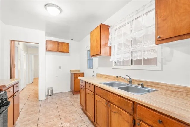 a spacious bathroom with a sink a mirror and a bathtub