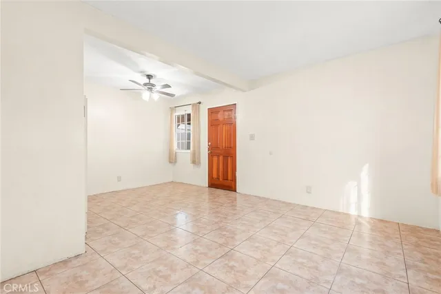 a view of hallway with chandelier fan and fire place