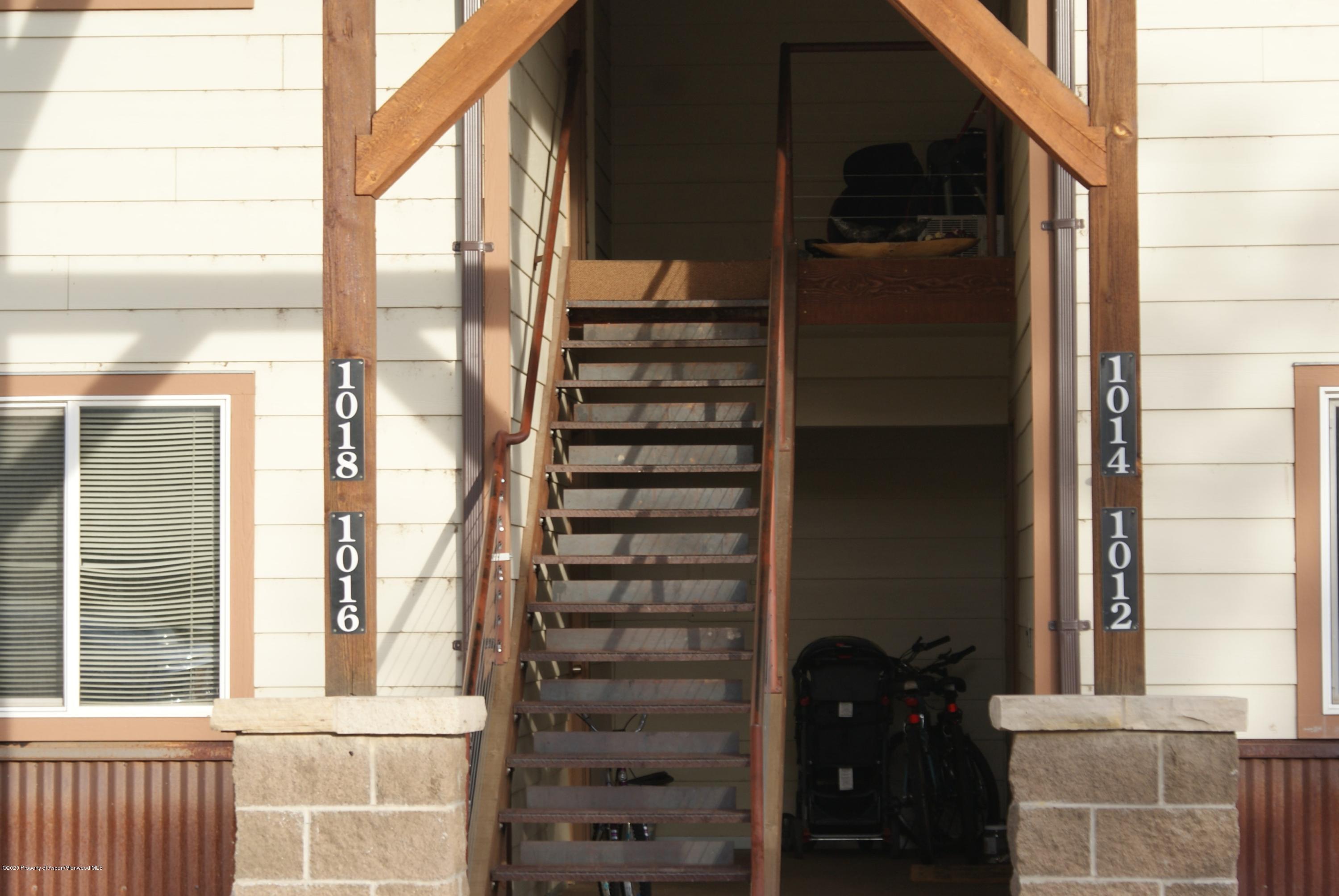 1012-1018 Stillwell Avenue Rifle, CO 81650 - Photo 2 of 15 a view of balcony with wooden floor and windows