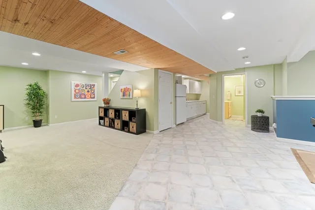 a big room with furniture and a chandelier