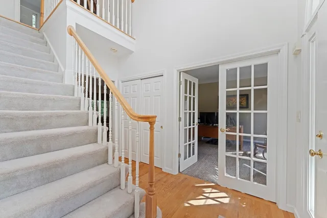 a view of staircase with white walls and windows