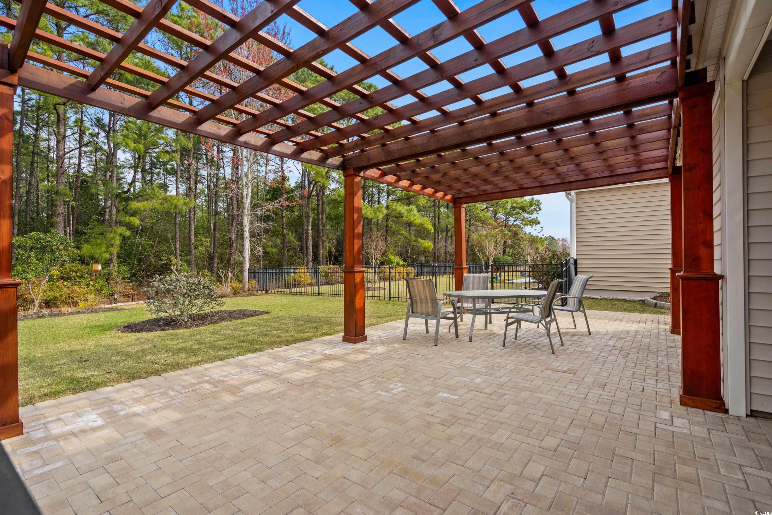 4284 Livorn Loop Myrtle Beach, SC 29579 - Photo 22 of 40 View of patio with outdoor dining area, a pergola,