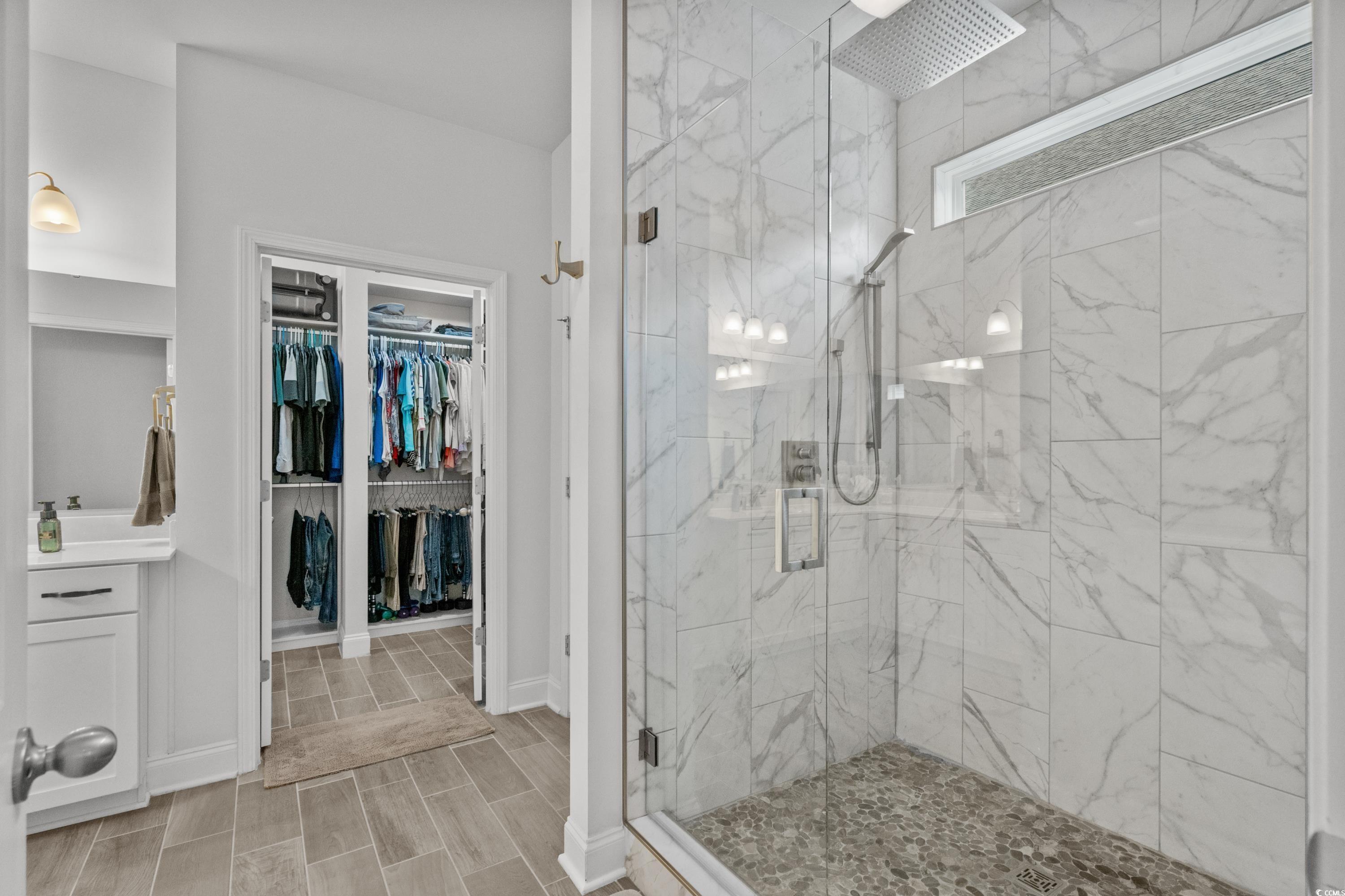 4284 Livorn Loop Myrtle Beach, SC 29579 - Photo 32 of 40 Bathroom with a marble finish shower, vanity, a wa