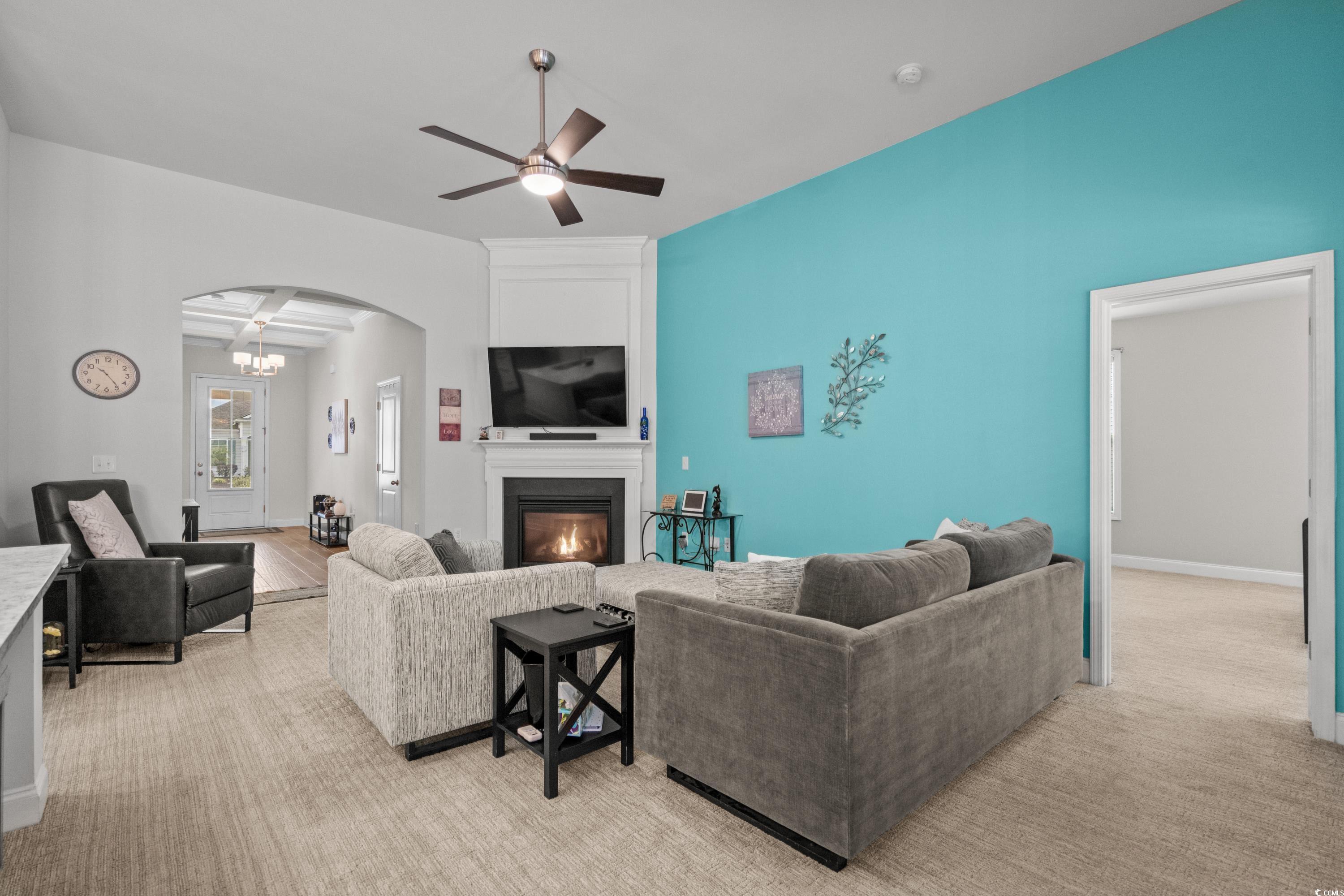 4284 Livorn Loop Myrtle Beach, SC 29579 - Photo 7 of 40 Living room with a large fireplace, arched walkway