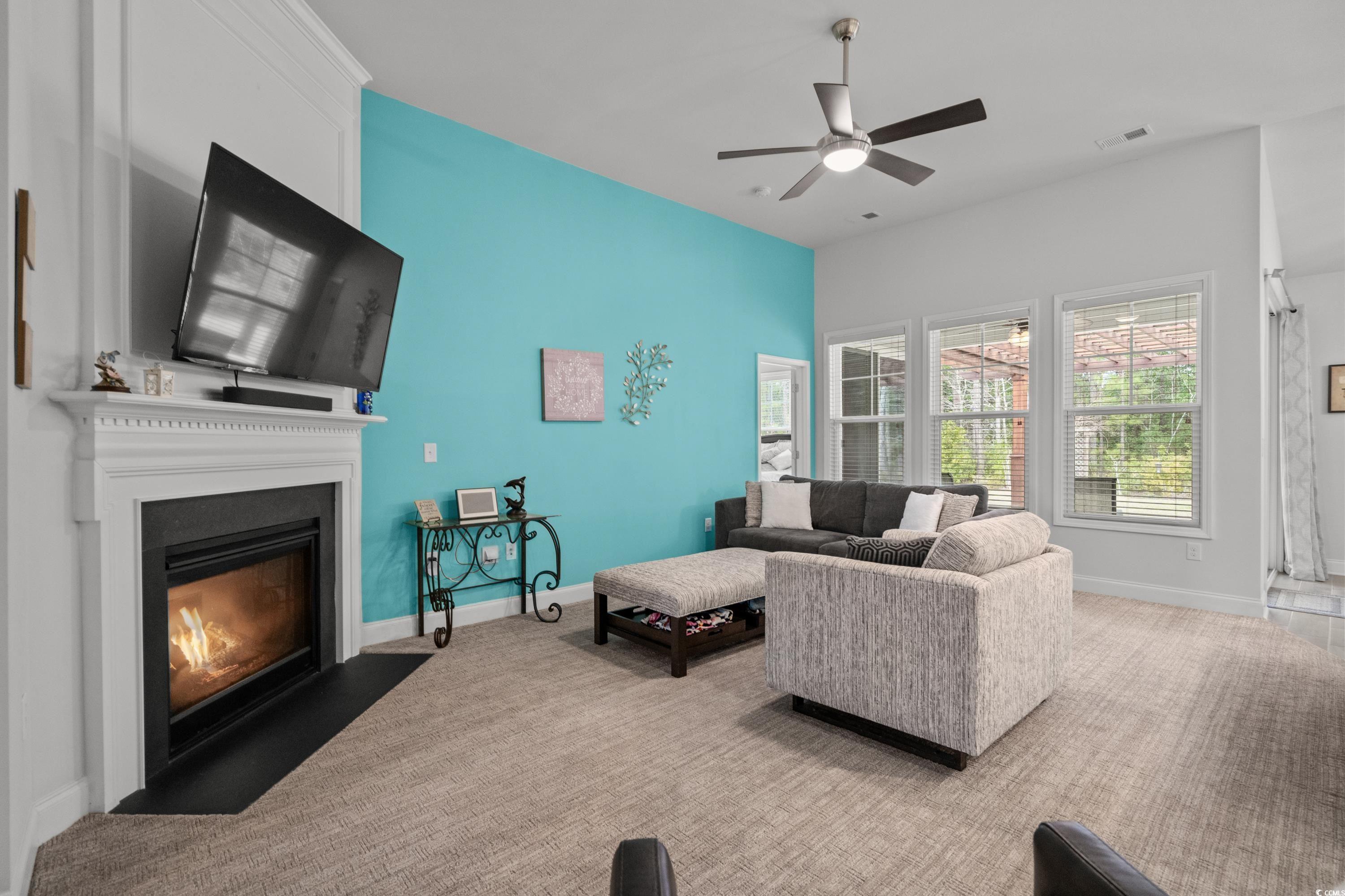 4284 Livorn Loop Myrtle Beach, SC 29579 - Photo 8 of 40 Living room featuring carpet, baseboards, visible