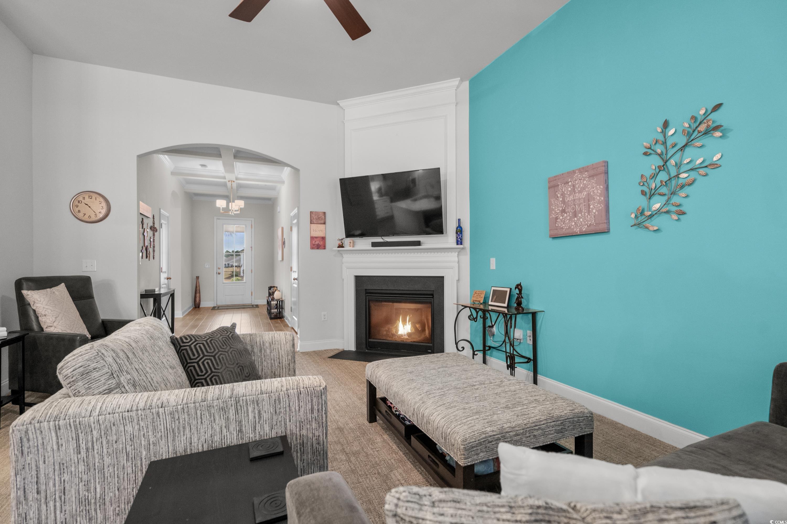 4284 Livorn Loop Myrtle Beach, SC 29579 - Photo 9 of 40 Living room featuring a ceiling fan, coffered ceil