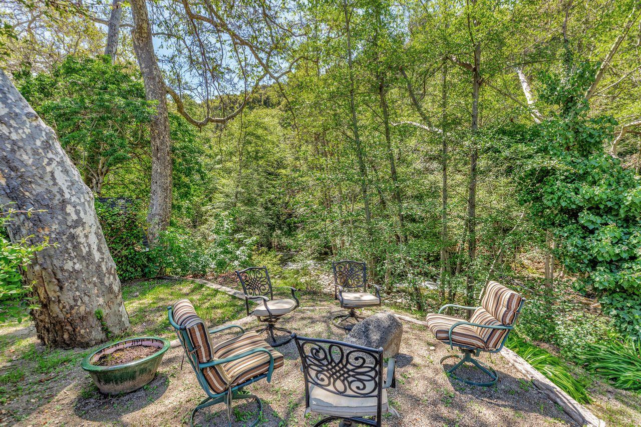 2 Camp Steffani Carmel Valley, CA 93924 - Photo 37 of 45 a view of a backyard with table and chairs and a fire pit