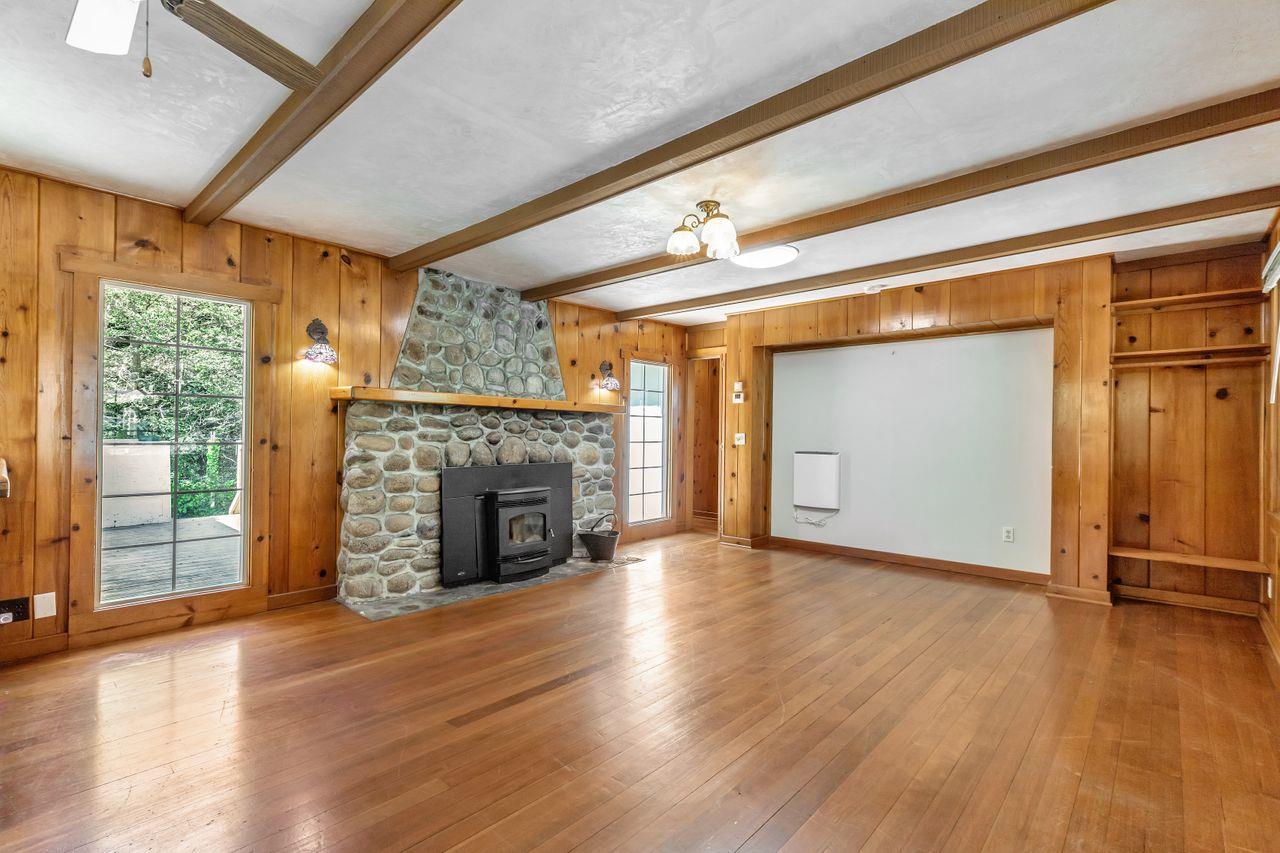 2 Camp Steffani Carmel Valley, CA 93924 - Photo 8 of 45 a view of an empty room with wooden floor fireplace and a window