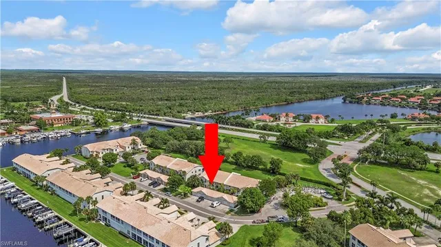 an aerial view of residential houses with outdoor space and seating