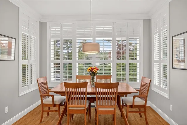 a dining room with furniture and windows