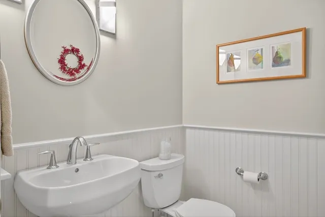 a bathroom with a toilet and a sink