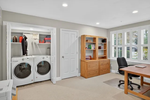 a living room with furniture and a closet
