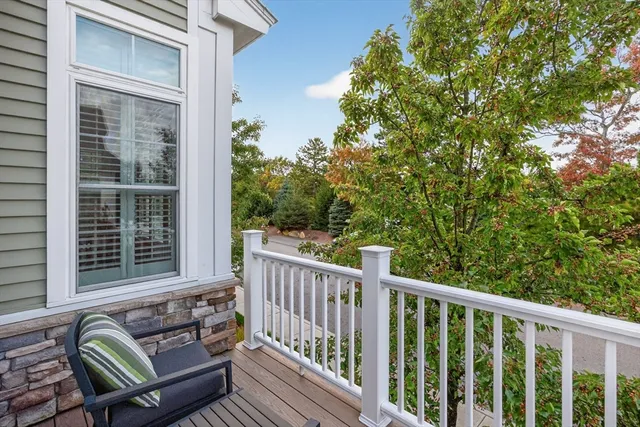 a view of a chair and table in the balcony