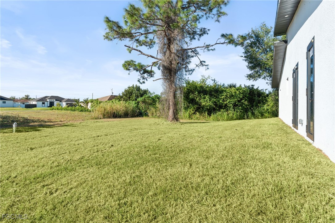 2603 3rd Street Southwest Lehigh Acres, FL 33976 - Photo 23 of 28 a view of a yard with an outdoor space