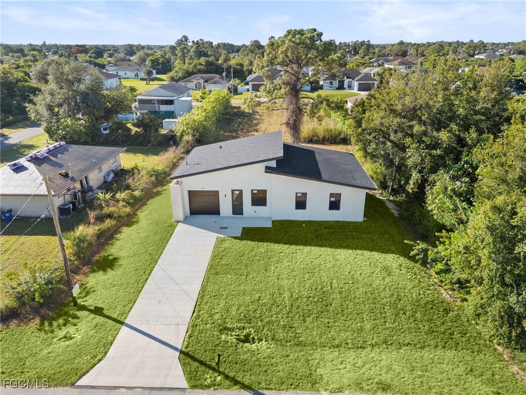 2603 3rd Street Southwest Lehigh Acres, FL 33976 - Photo 24 of 28 a aerial view of a house with a yard
